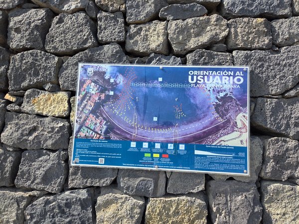 Orientation board showing rip-current map and safety tips for Punta Brava Beach.