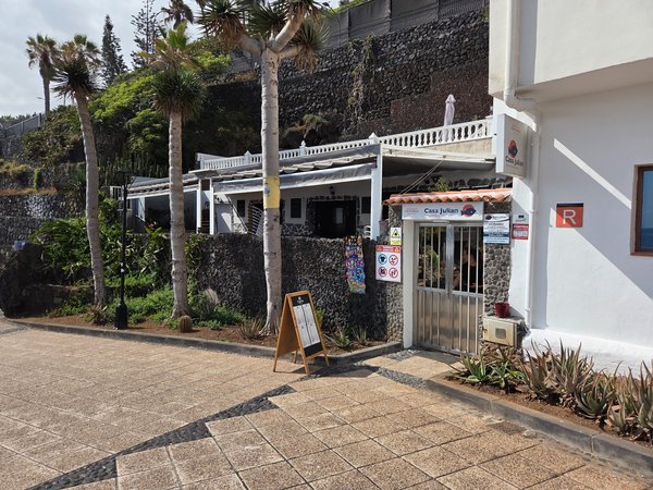 Seafront restaurant Casa Julián with terrace overlooking Punta Brava promenade.