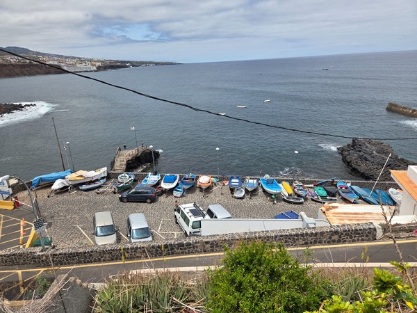 Small fishing boats stored on the slipway at the harbor of Punta del Hidalgo.