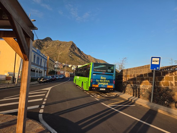TITSA bus at a Punta del Hidalgo stop with Anaga mountains behind.
