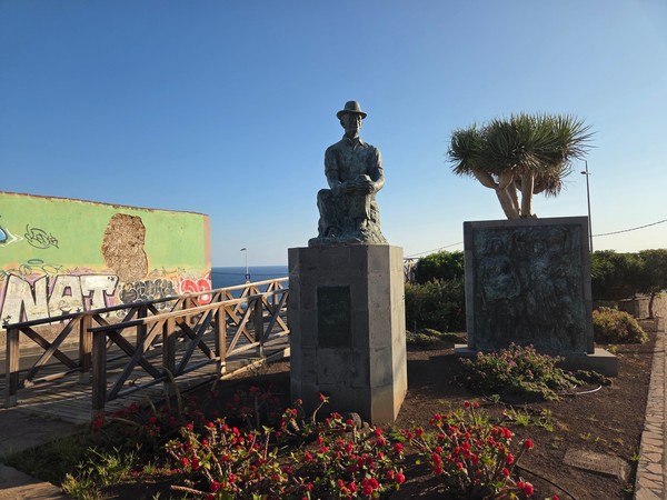 Public sculptures and a dragon tree near the seafront of Punta del Hidalgo.