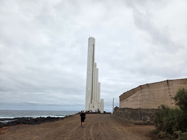 El Faro de Punta del Hidalgo lighthouse rising above the Atlantic coast.