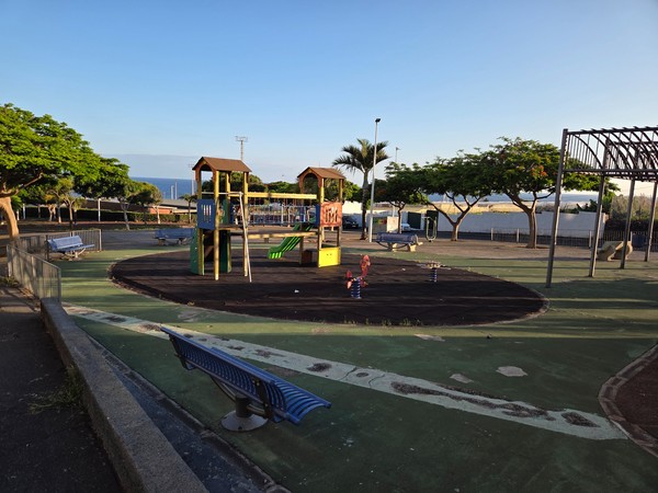 Public playground with benches and sea views in Punta del Hidalgo.
