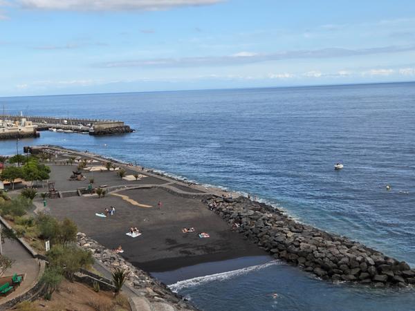 Aerial view of the peaceful black sand beach of Radazul Bajo.