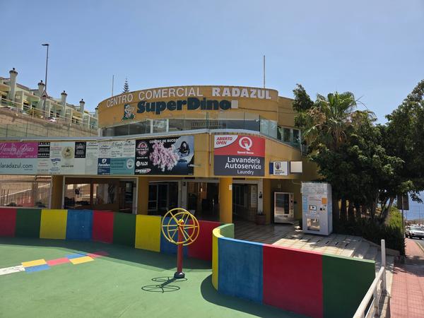 The central commercial zone with supermarket and local services.