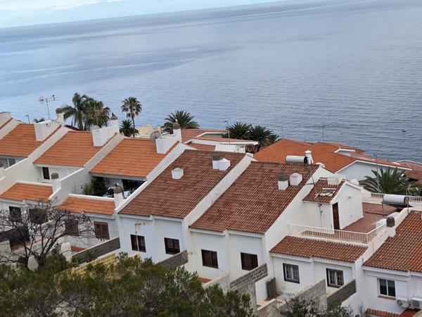 White houses with terracotta roofs overlooking the Atlantic.