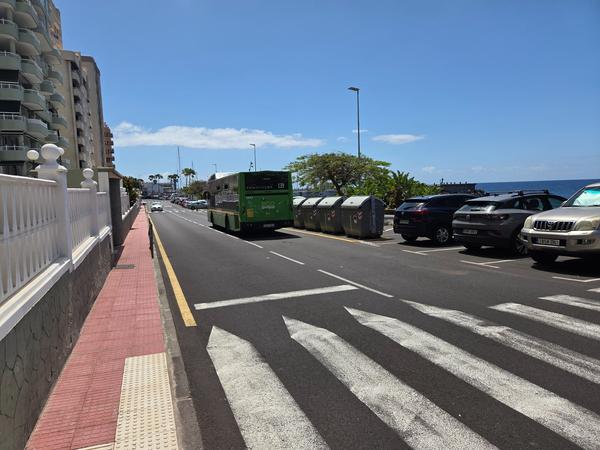 Green Titsa public bus on the seafront road in Radazul Bajo.