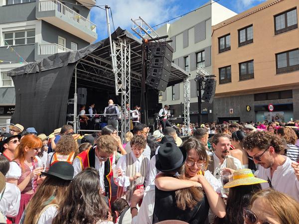 Live concert stage with people enjoying the music during the festival.