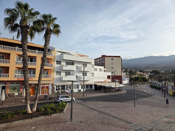 Apartments and small shops along the beachfront avenue of Playa San Juan.