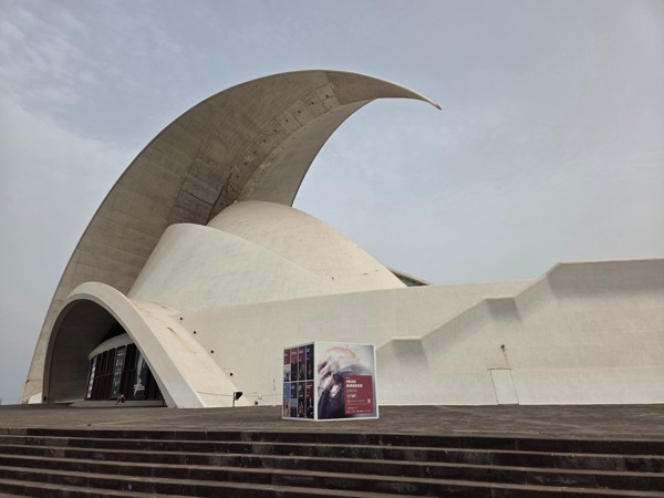 Close view of the curved white concrete roof and façade of the Auditorio de Tenerife on the Santa Cruz seafront.