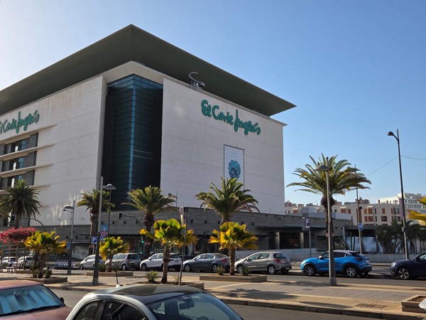 El Corte Inglés department store building with palm trees along the avenue in Santa Cruz de Tenerife.