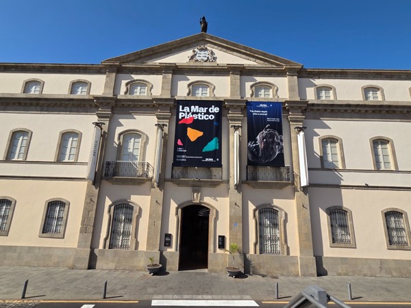 Front elevation of MUNA, the Museum of Nature and Archaeology in Santa Cruz de Tenerife, with exhibition banners.