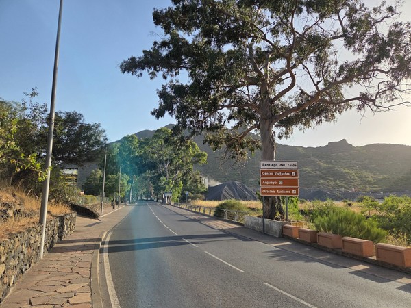 Tourist sign pointing to Santiago del Teide, the visitor centre, Arguayo and the tourism office on the main road.