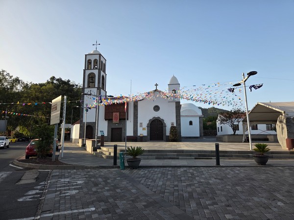 Facade of the Iglesia de San Fernando Rey on the main square of Santiago del Teide decorated for local fiestas.