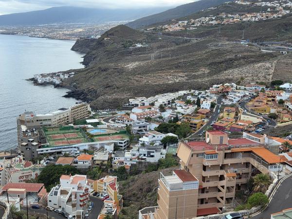 Bird’s-eye view over coastal communities and cliffs