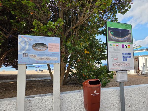 Educational signage informs visitors about the beach’s ecosystem and local marine species, including the endangered angel shark.
