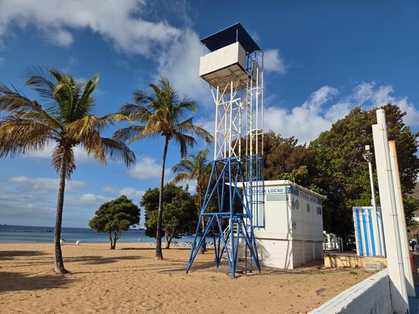Next to the lifeguard station stands the Policía Local tower, overseeing the beach for additional security and coordination.